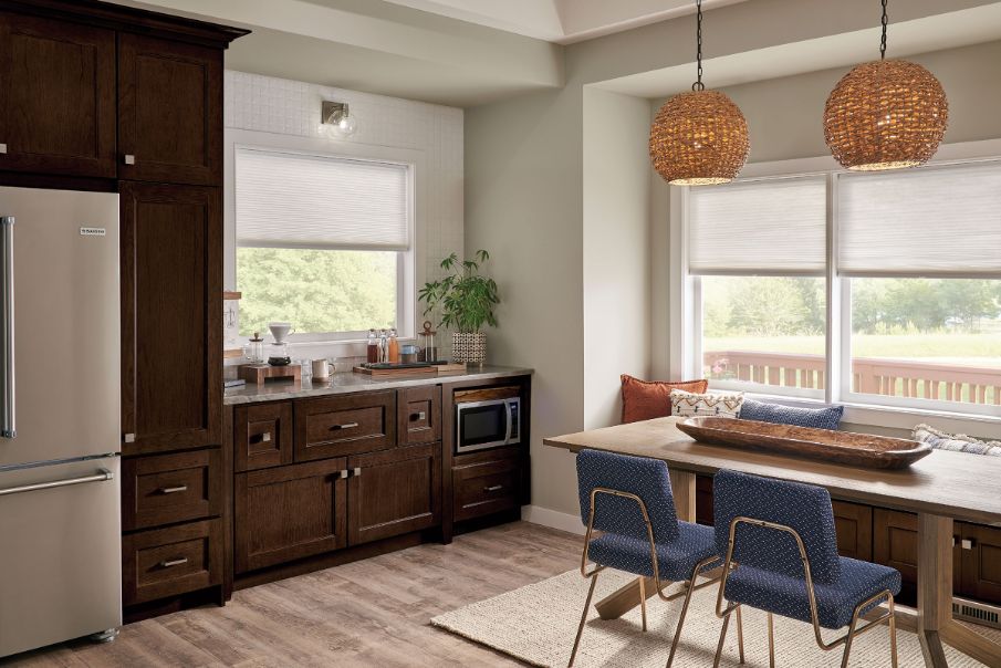 Contemporary KraftMaid kitchen with corner coffee station next to built-in dining banquette