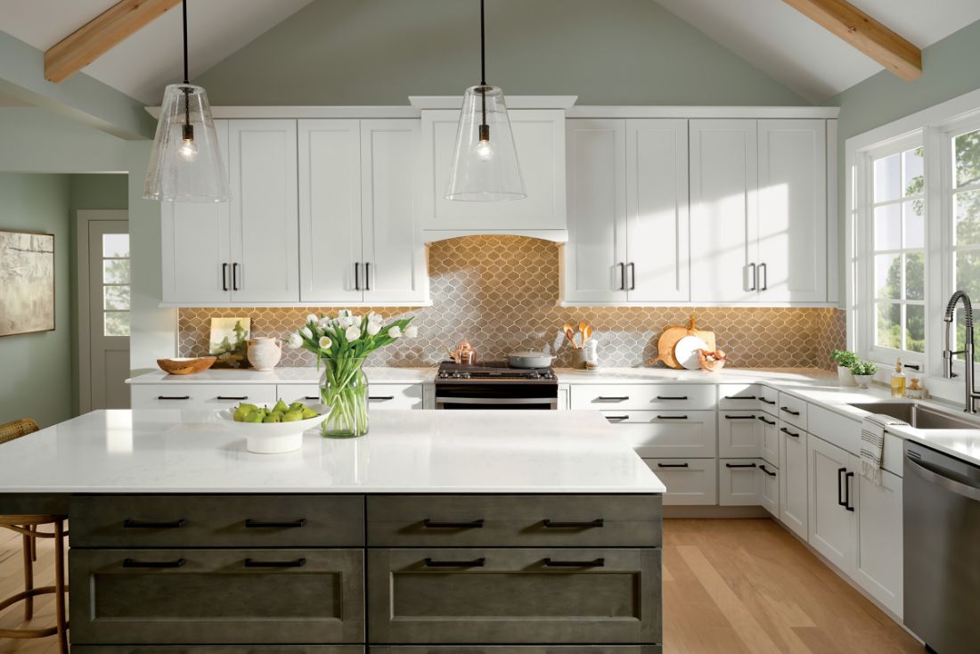 Cozy, hygge-style kitchen design with KraftMaid Shaker cabinets in Dove White and Cannon Grey.