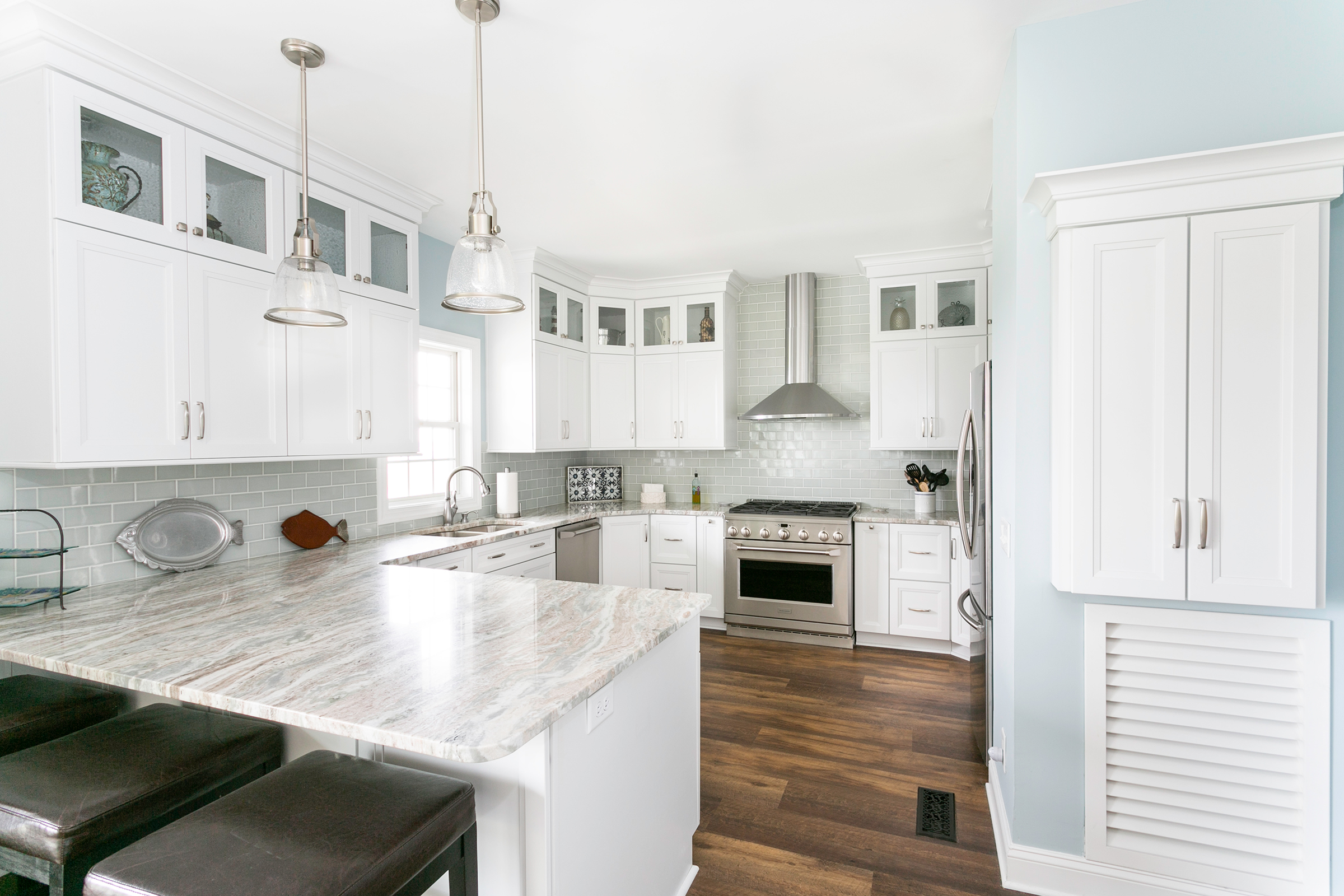 Bright and airy coastal-style kitchen with KraftMaid Dove White cabinets