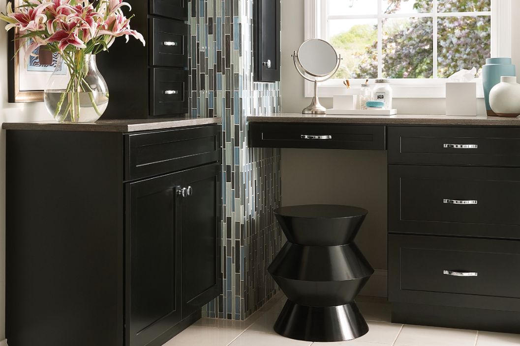 Contemporary bathroom with vanity seating area featuring KraftMaid cabinetry in Onyx paint