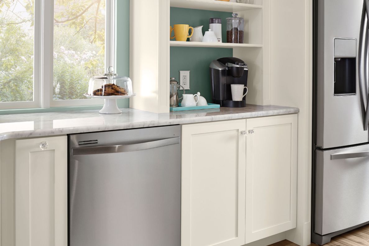 Countertop bookcase used to create a coffee bar in a Dove White KraftMaid kitchen