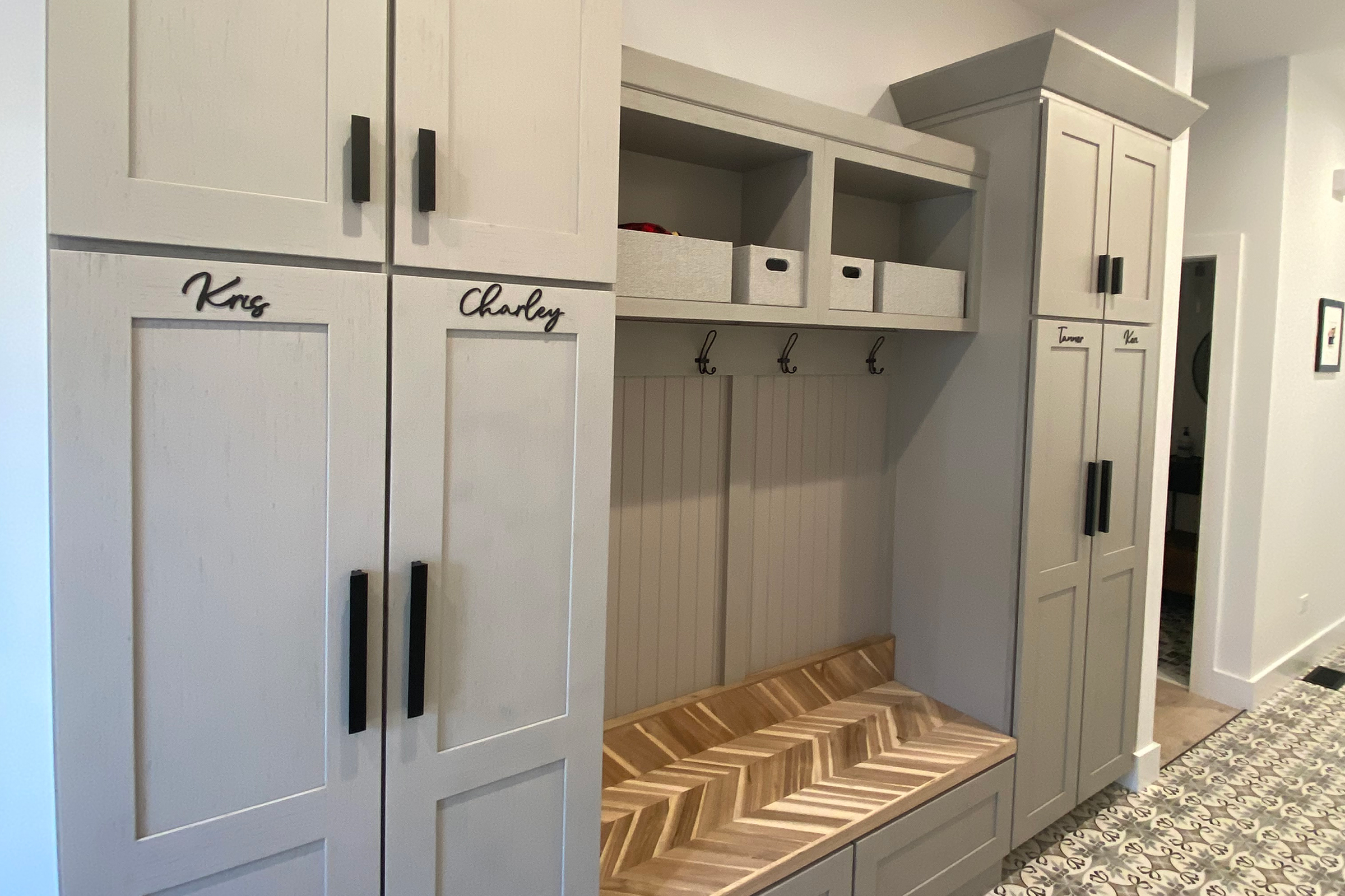 KraftMaid angled crown molding on cabinets used as entry hall storage