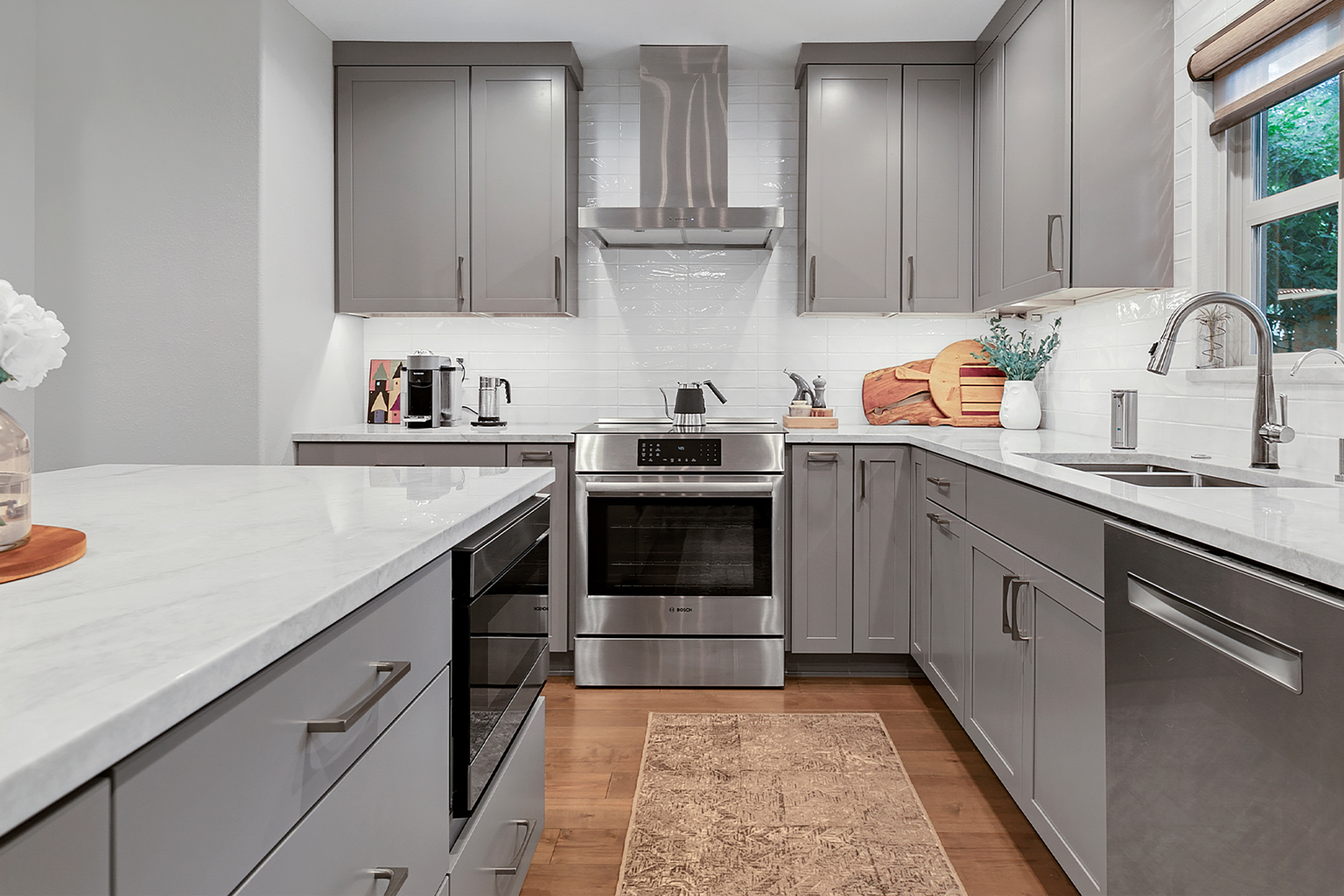 KraftMaid Shaker-style cabinet door and wine cooler tucked into under-stair alcove