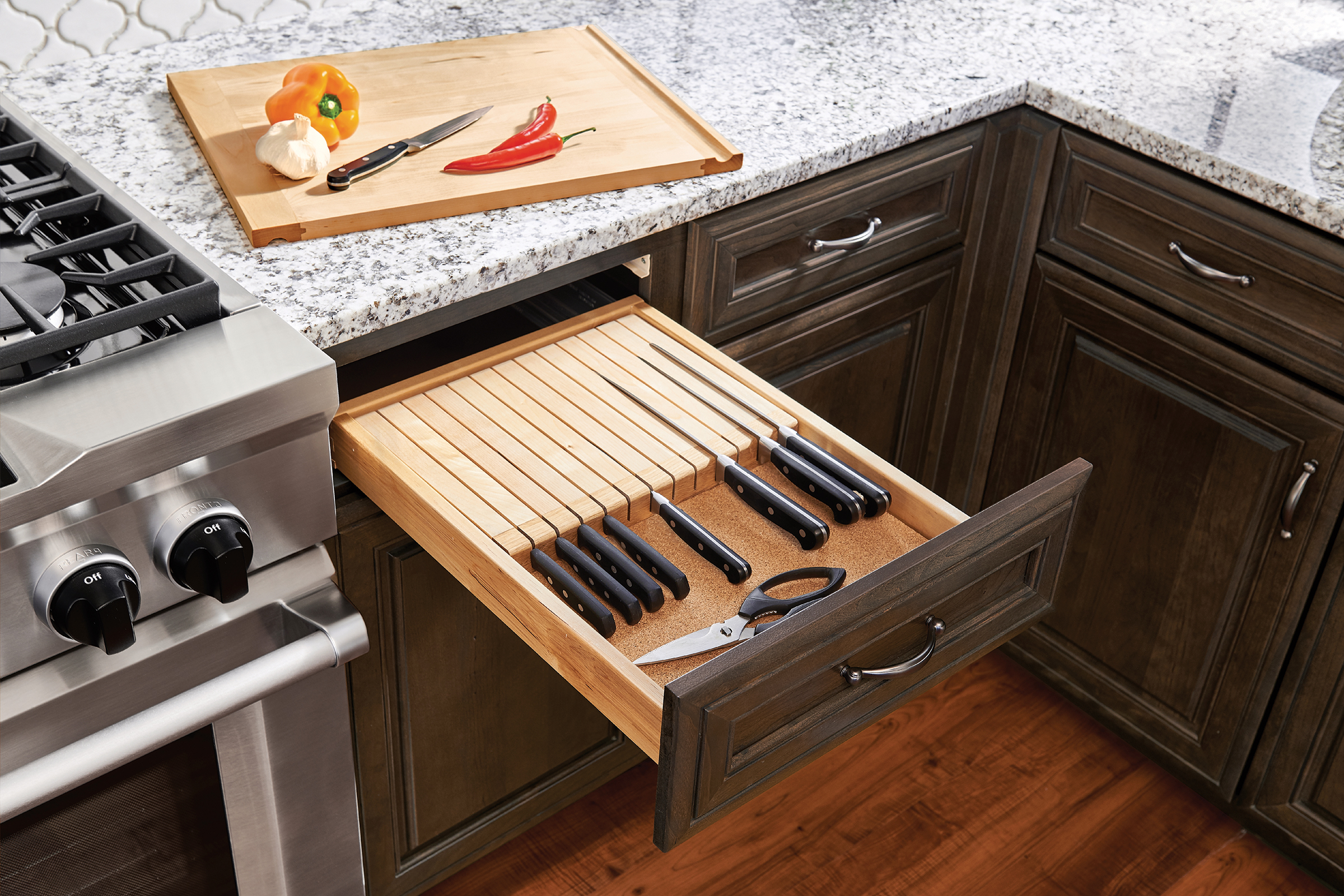 Cabinet drawer with a built-in kitchen drawer knife block storage