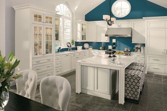 Colorful accent wall for all-white kitchen.