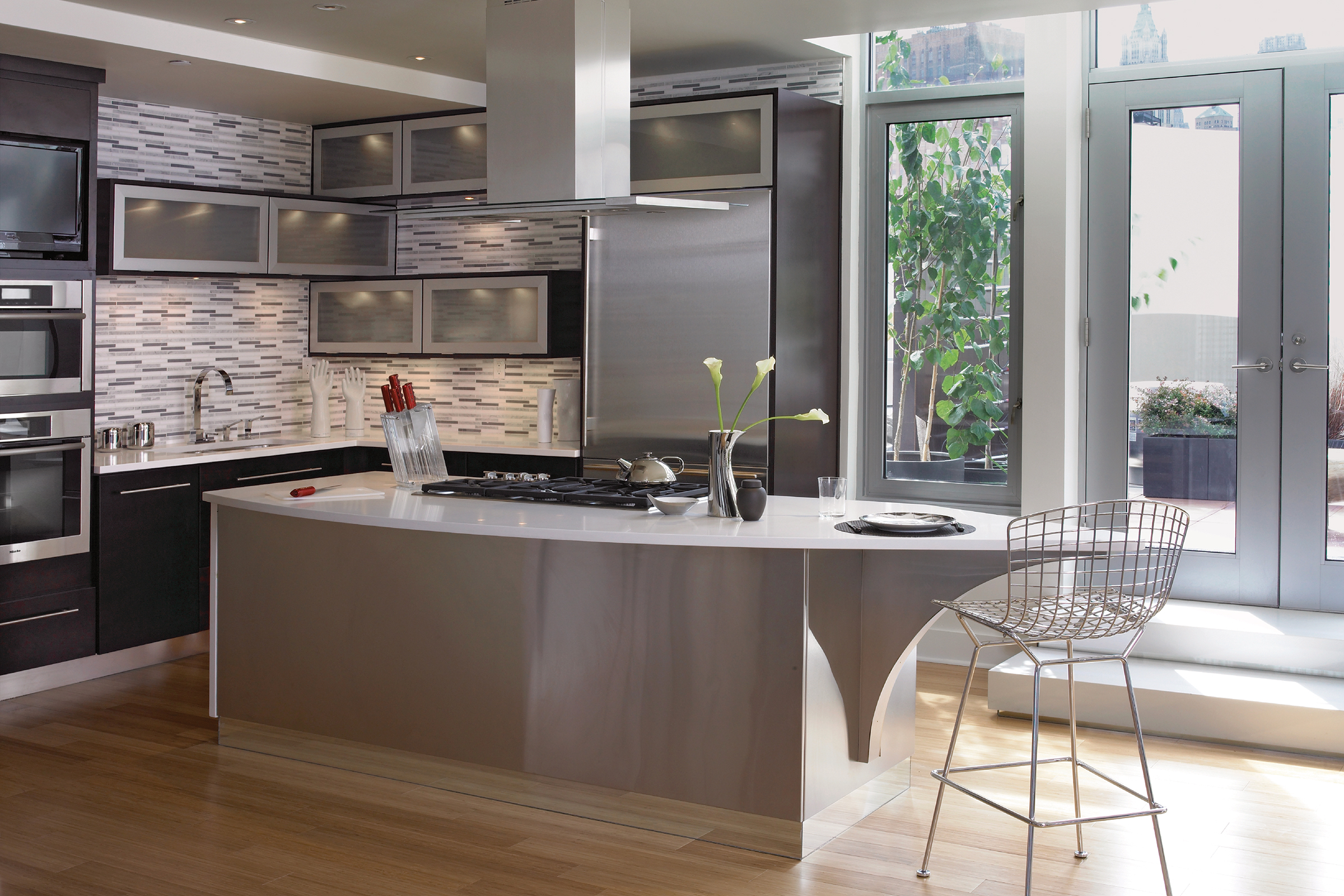 Modern-style kitchen featuring KraftMaid cabinets with aluminum-frame glass kitchen cabinet doors