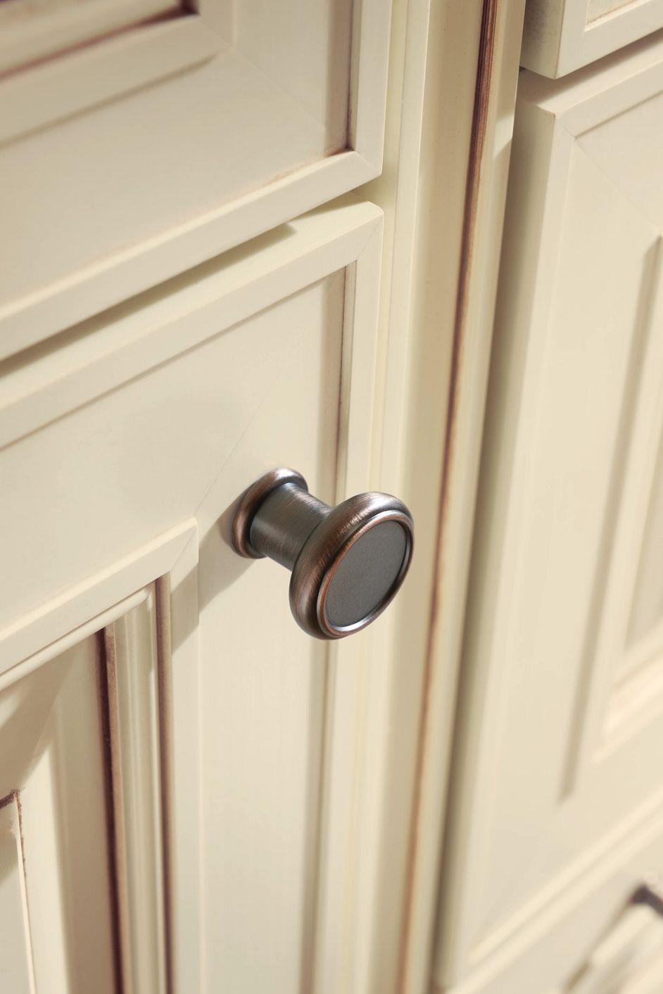 For a more updated look, center the knob on the cabinet door frame and align it with the edge of the door’s center panel.