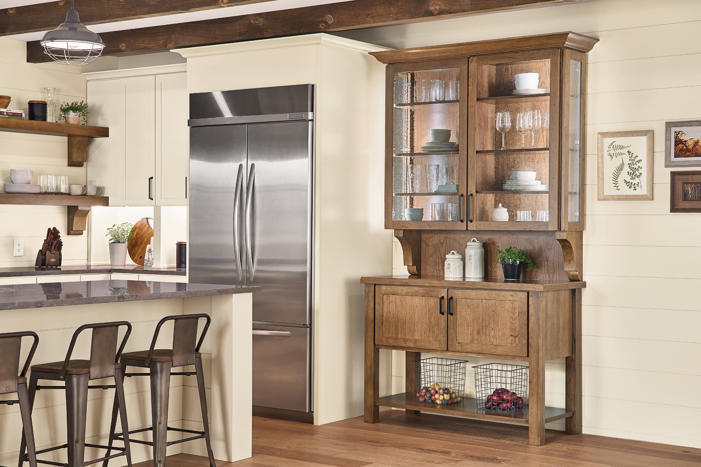 Furniture-style farmhouse kitchen hutch in Aged Bourbon finish with KraftMaid seeded glass door inserts