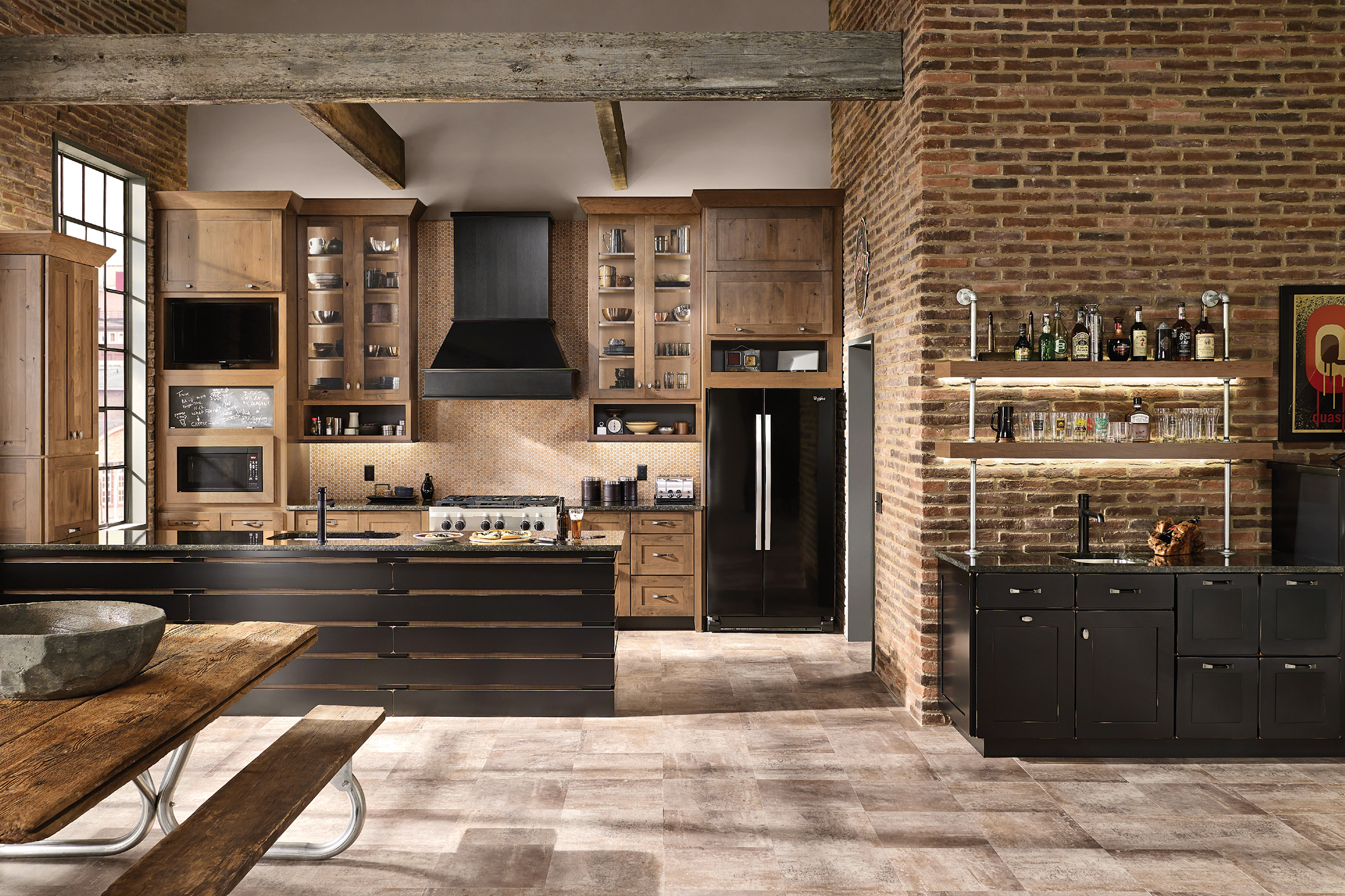 Rustic industrial style kitchen with KraftMaid cabinets in a two-tone paint and stain finish combination