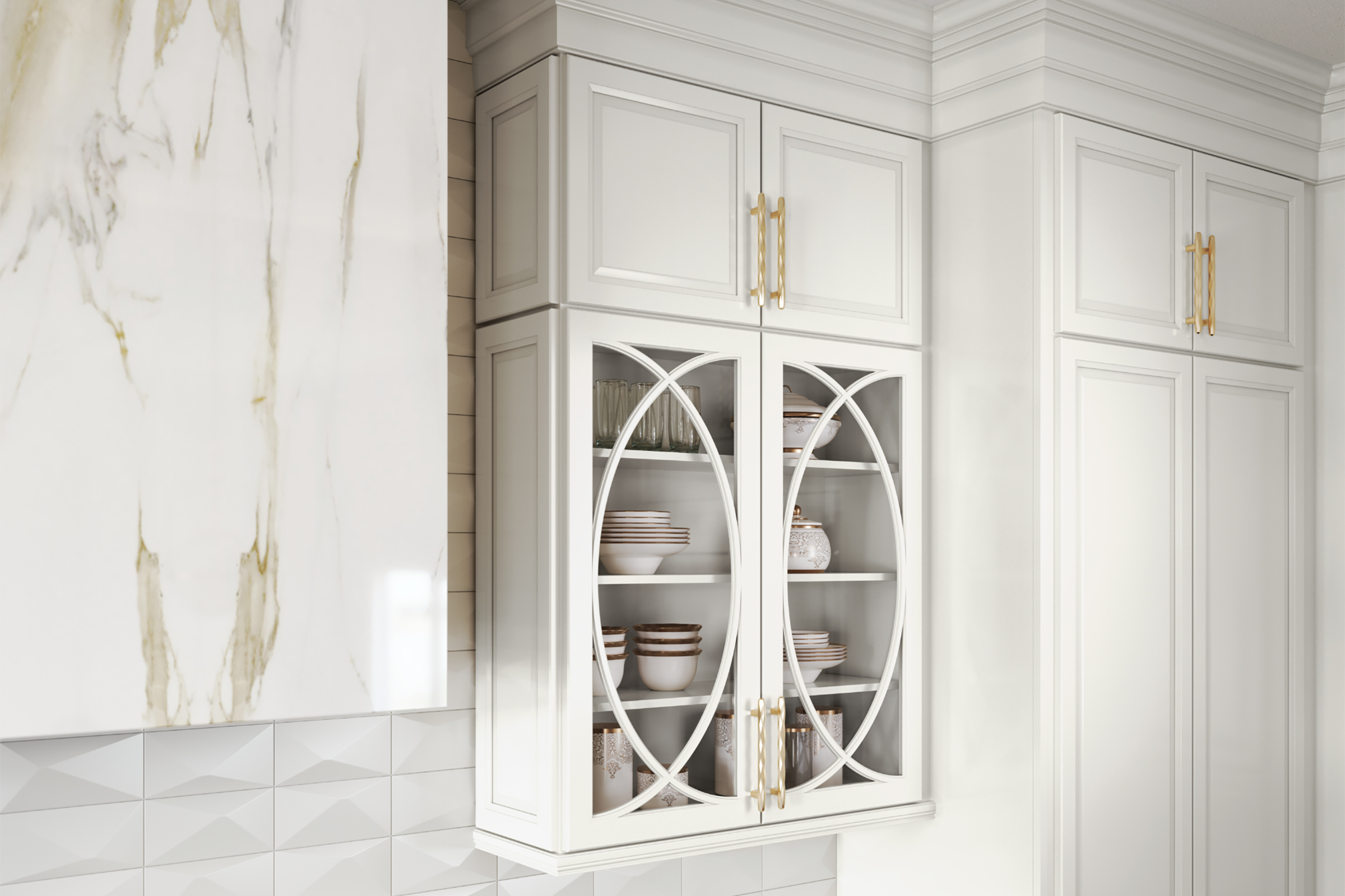 Detail of KraftMaid Palladia glass door upper cabinets in Frost white paint with Luxe pulls in Champagne Gold finish