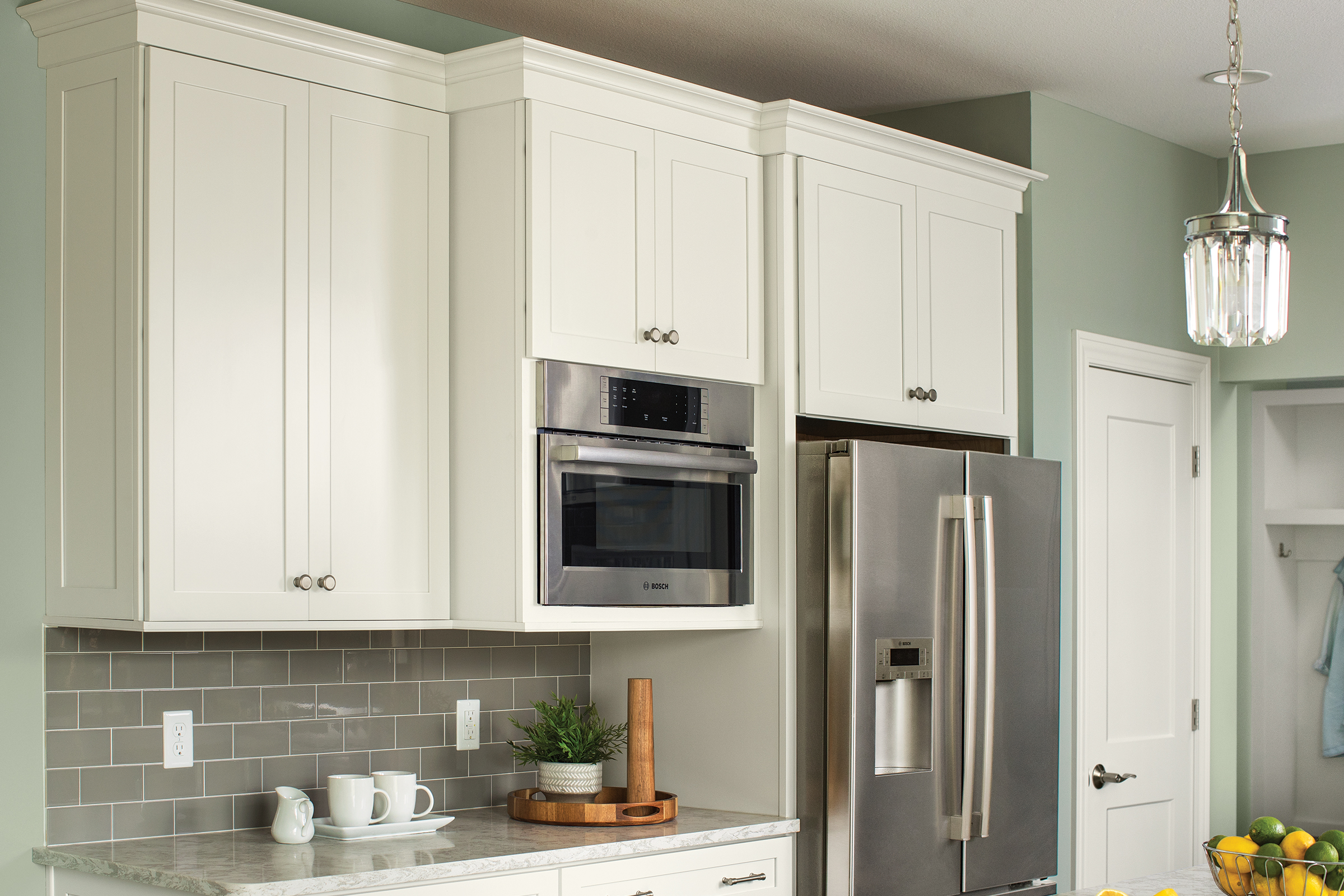 Shaker-style KraftMaid standard kitchen wall cabinets in Dove White finish