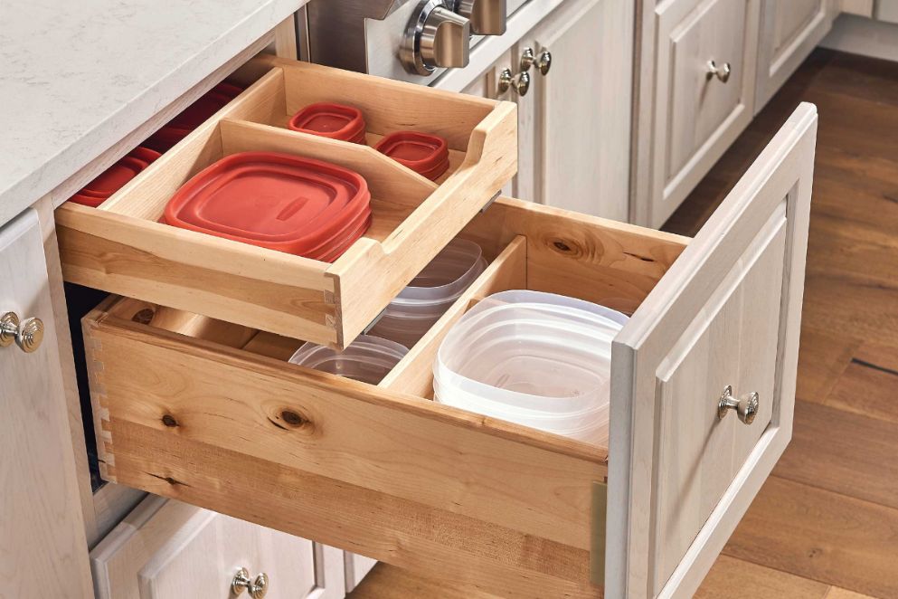 Space savers with KraftMaid toe kick kitchen drawers.