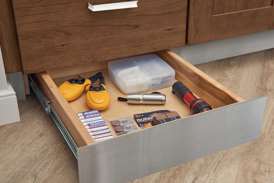 Space savers with KraftMaid toe kick kitchen drawers.