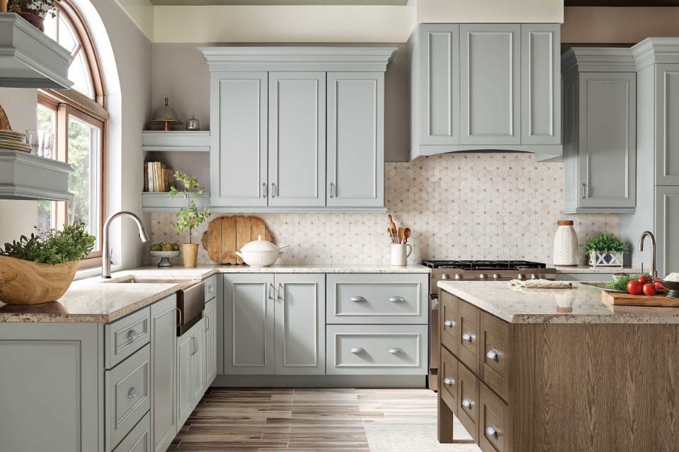 Traditional kitchen with warm grey and rich brown KraftMaid cabinet colors